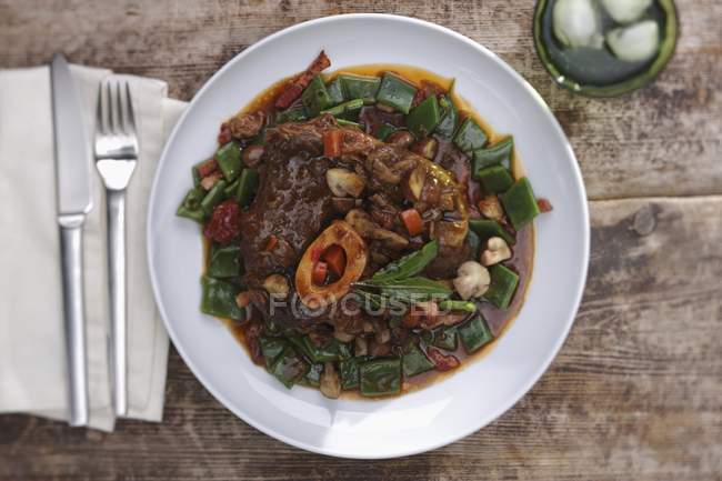 Osso buco with beans — Stock Photo