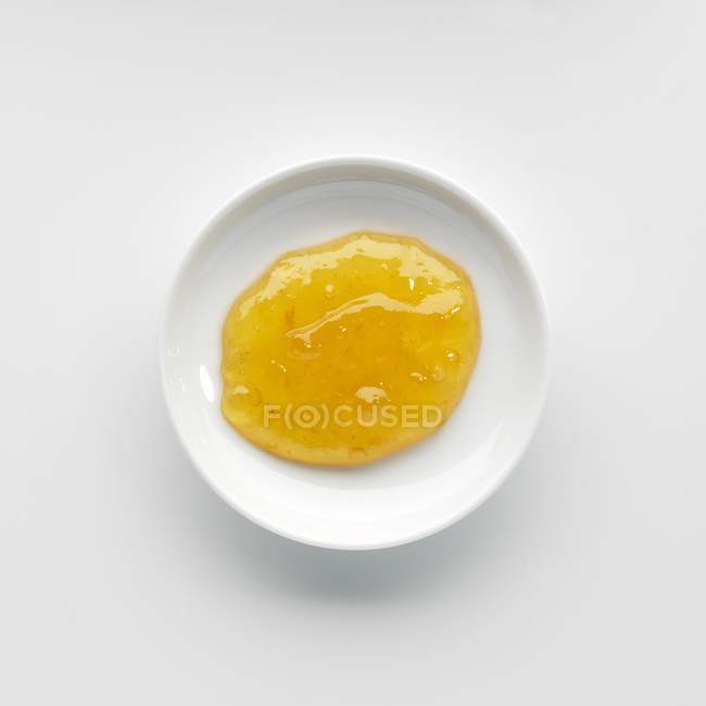 Portion of apricot jam in bowl — Stock Photo