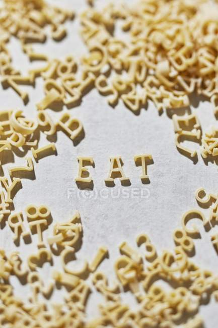 Word EAT of pasta — Stock Photo
