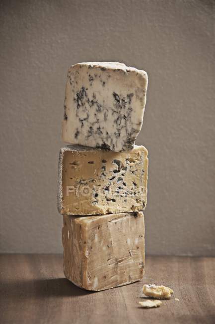 Stack of various cheeses — Stock Photo