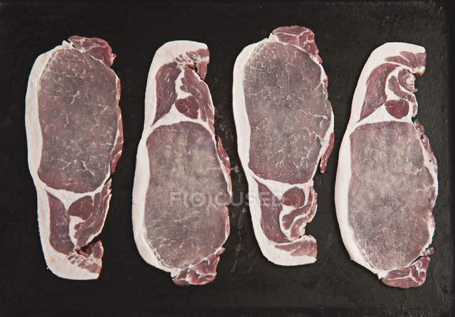 Raw bacon slices — Stock Photo
