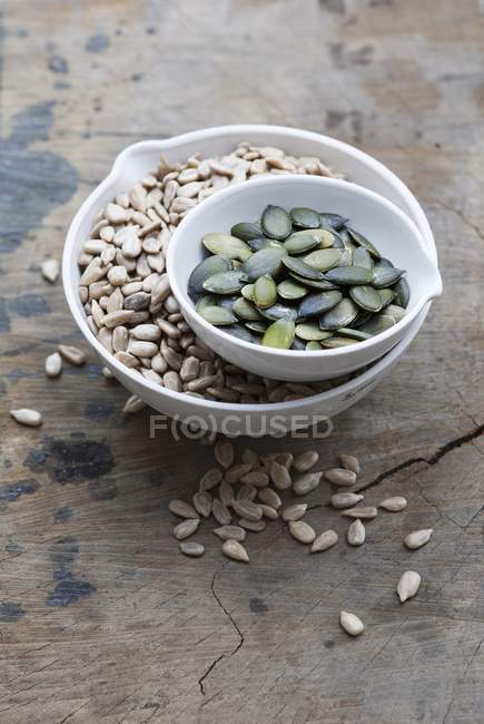 Bowls of sunflower seeds — Stock Photo
