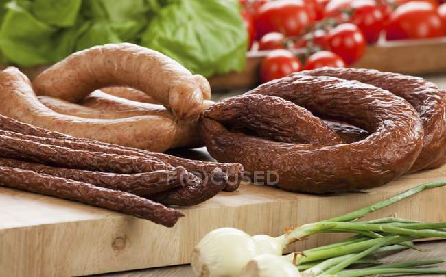 Various sausages on board — Stock Photo