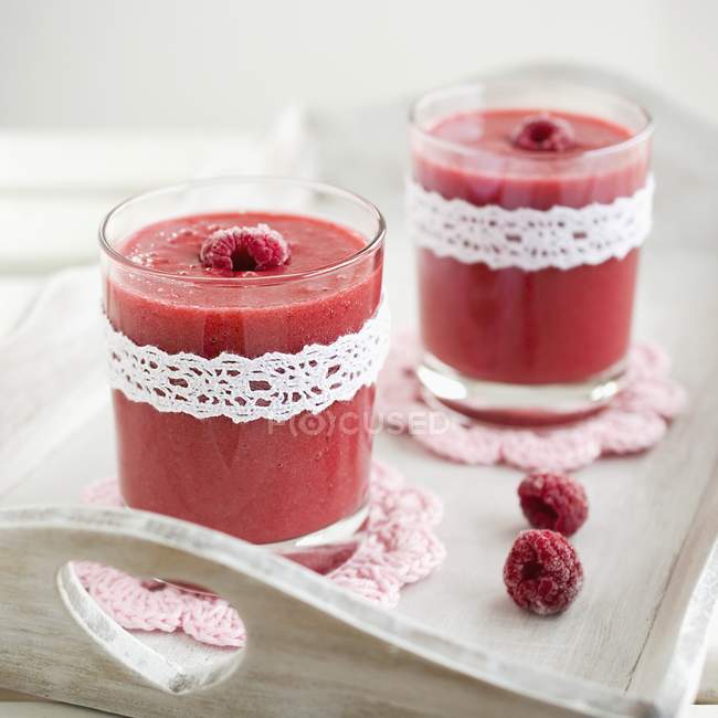 Raspberry and banana smoothies — Stock Photo