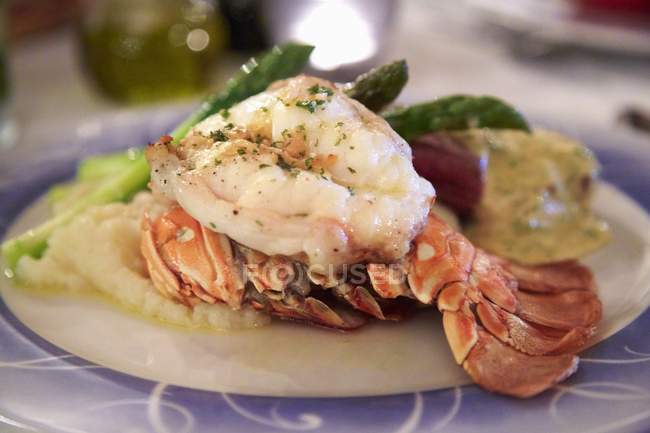 Lobster and steak with asparagus — Stock Photo
