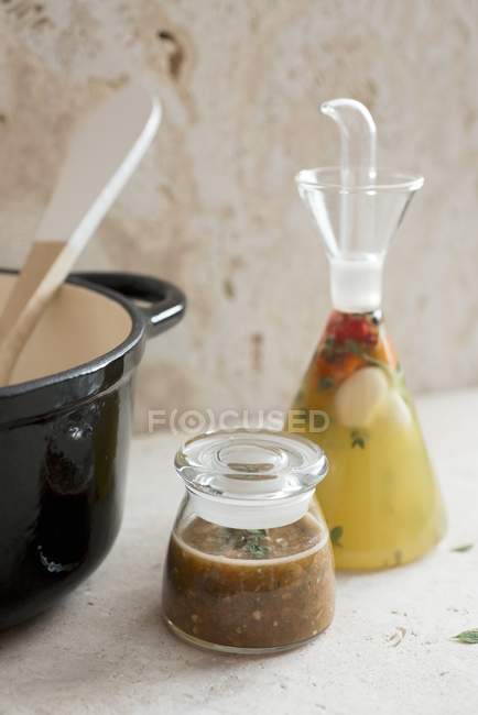 Spiced vinegar from the Caribbean on white surface — Stock Photo
