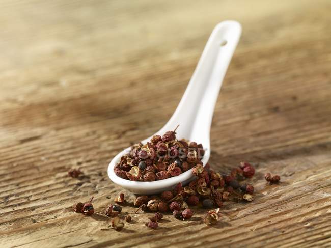 Szechuan pepper on spoon — Stock Photo