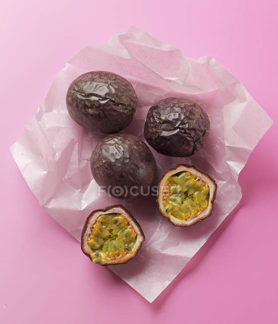 Passion fruits on piece of paper — Stock Photo