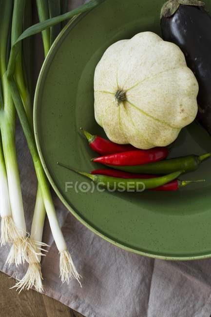 Pattypan squash with chilli peppers — Stock Photo
