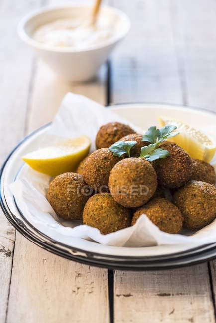 Falafel chickpea balls serving with lemon — Stock Photo