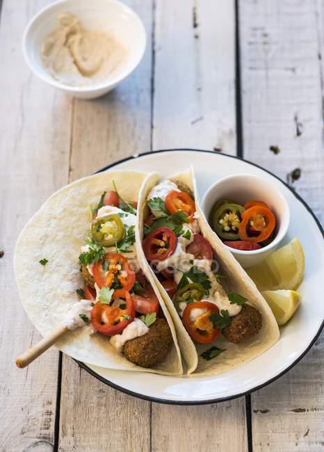 Tortilla filled with falafel, hummus and chillis — Stock Photo