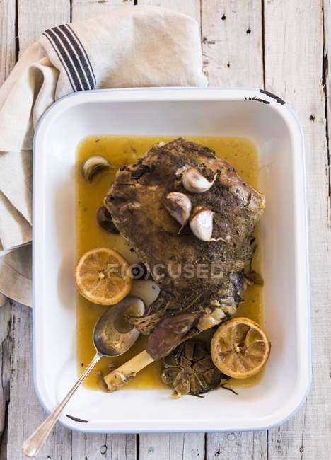 Roasted leg of lamb with garlic — Stock Photo