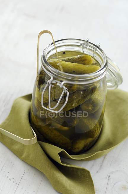 Glass  jar of cornichons — Stock Photo