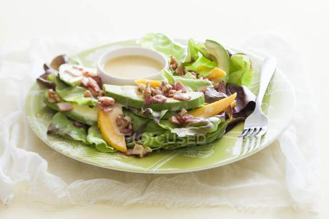 Mango and avocado salad with nuts — Stock Photo
