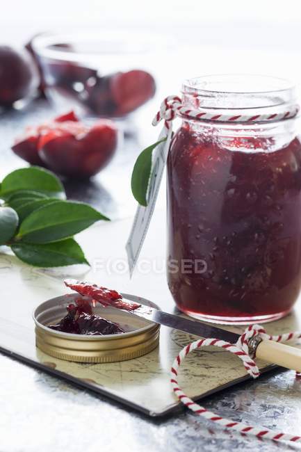 Jar of plum jam — Stock Photo