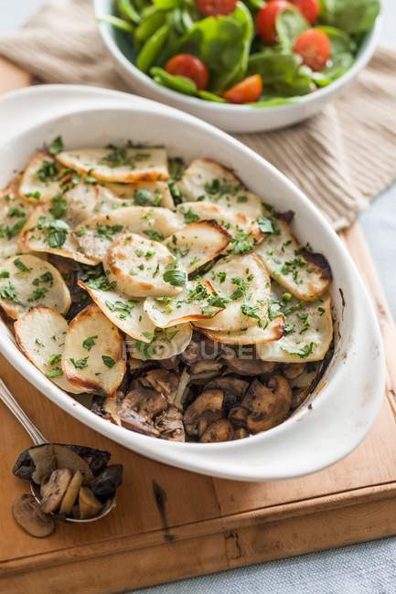 Baked mushrooms and potatoes with herbs — Stock Photo