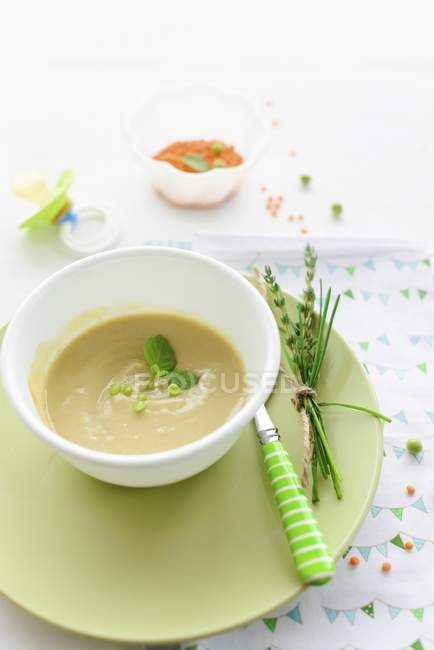 Red lentil pure as baby food in white bowl — Stock Photo