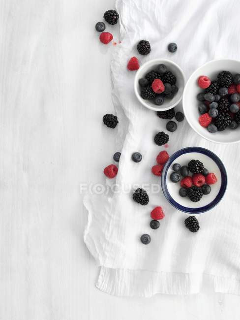 Bowls of fresh summer berries — Stock Photo