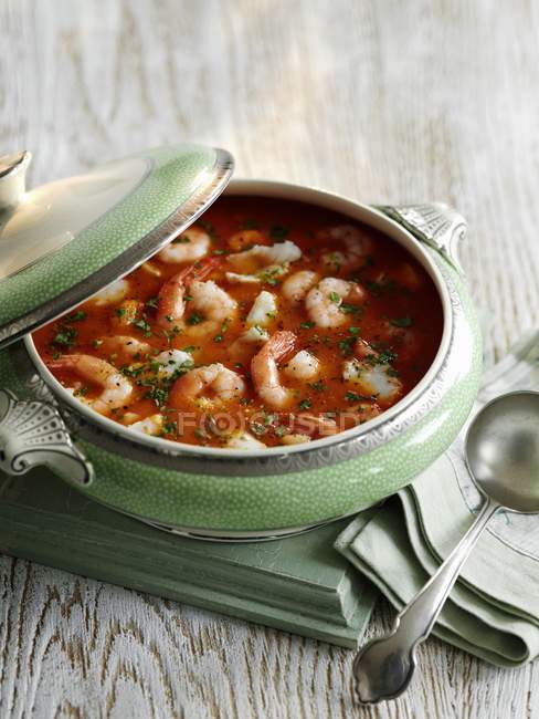 Closeup view of prawn Bisque with parsley in pot — Stock Photo