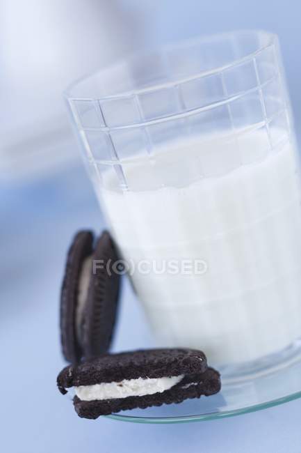 Two Oreos and glass — Stock Photo