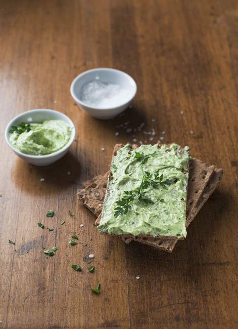 Crispbread with herb butter — Stock Photo