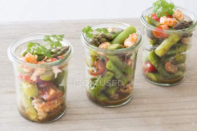 Asparagus salad with crayfish in glasses — Stock Photo