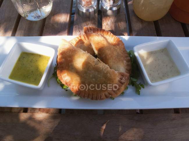Elevated view of mushroom pasties and dips — Stock Photo