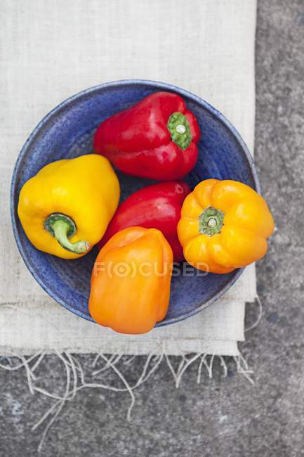 Bowl of colourful peppers — Stock Photo