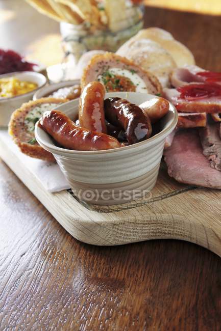 Elevated view of a platter with sausages and Scotch eggs — Stock Photo