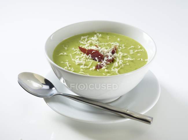 Cream of pea soup in white bowl — Stock Photo
