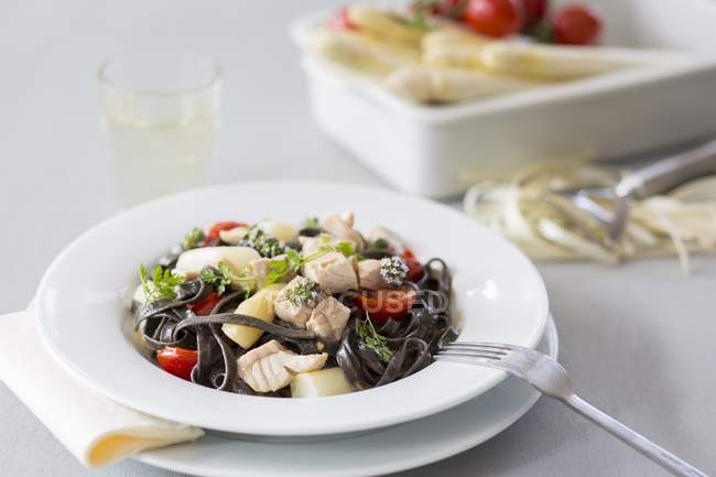 Black tagliatelle pasta — Stock Photo