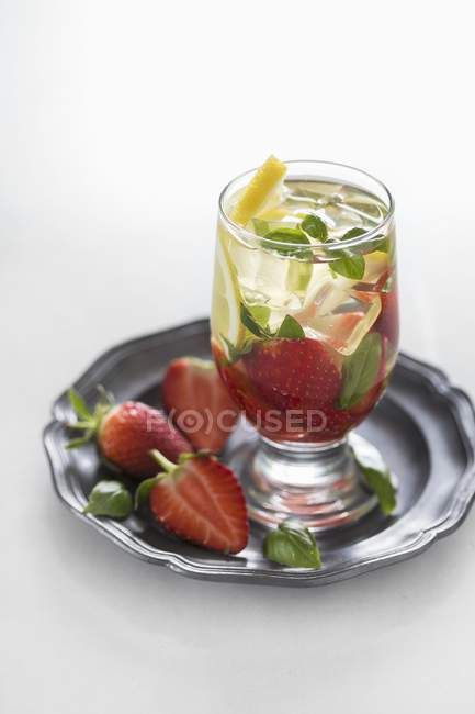 Water flavoured with strawberries — Stock Photo