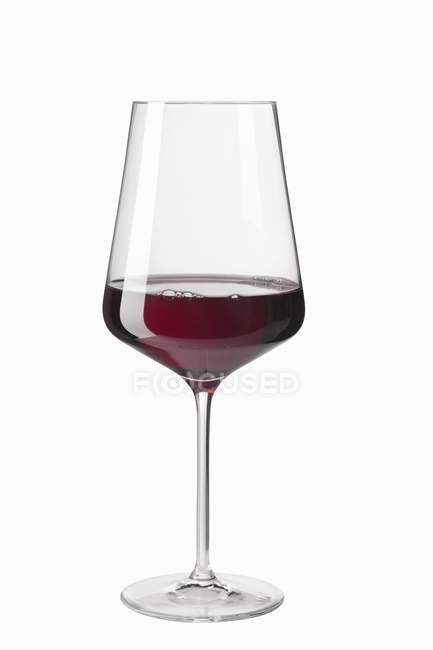 Closeup view of glass of red whine on white background — Stock Photo