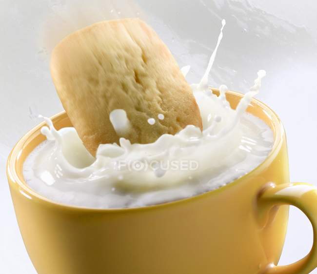 Shortbread biscuit falling — Stock Photo