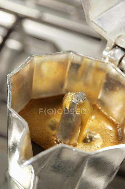 Coffee boiling in espresso jug — Stock Photo