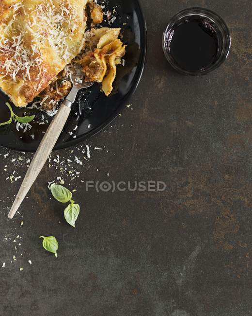 Portion of lasagne on plate — Stock Photo