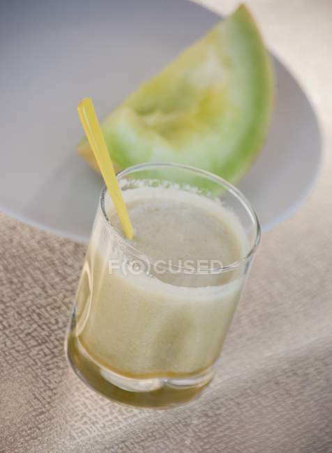 Melon smoothie in glass — Stock Photo