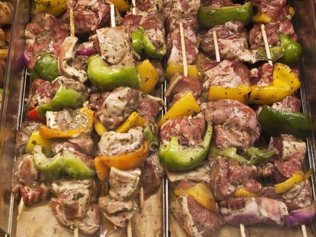 Raw lamb and kebabs — Stock Photo