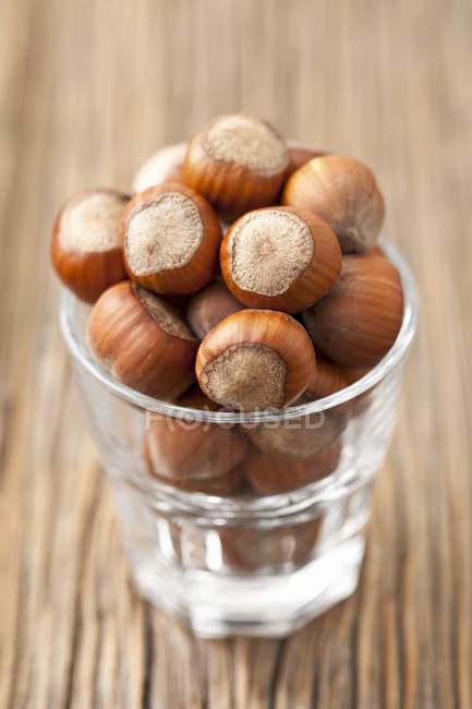 Glass of whole hazelnuts — Stock Photo