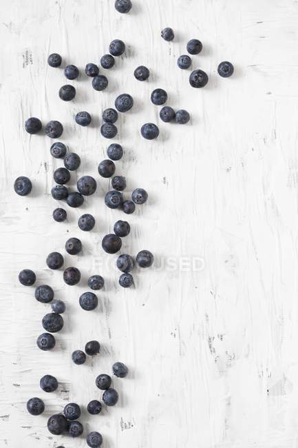Blueberries scattered on table — Stock Photo