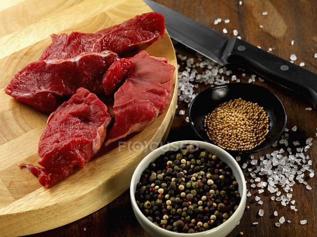 Beef on wooden desk — Stock Photo