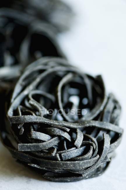Black ink pasta nest — Stock Photo