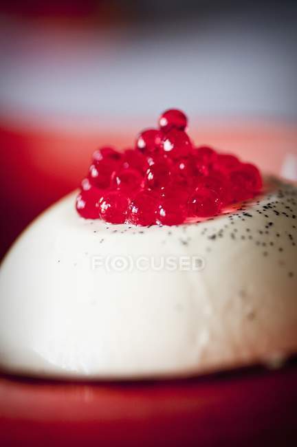 Panna cotta with raspberry caviar — Stock Photo