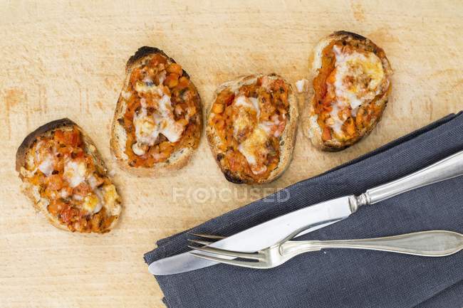 Bruschetta topped with tomatoes — Stock Photo