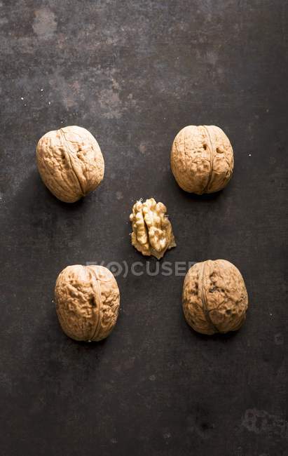 Four whole walnuts — Stock Photo