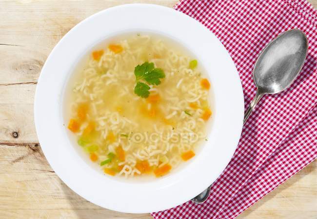 Alphabet pasta soup in deep plate — Stock Photo