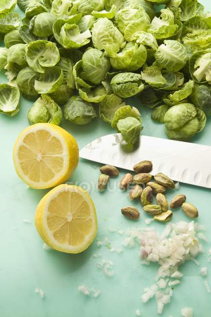 Brussels sprouts with knife — Stock Photo