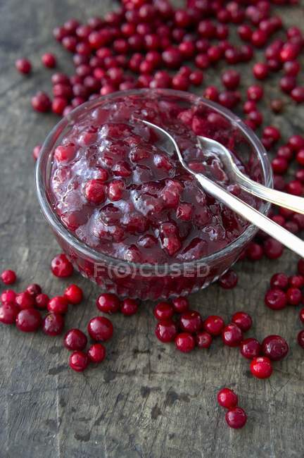 Closeup view of lingonberry sauce in a glass bowl — Stock Photo