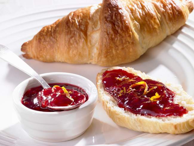 Croissant with fruit jam — Stock Photo