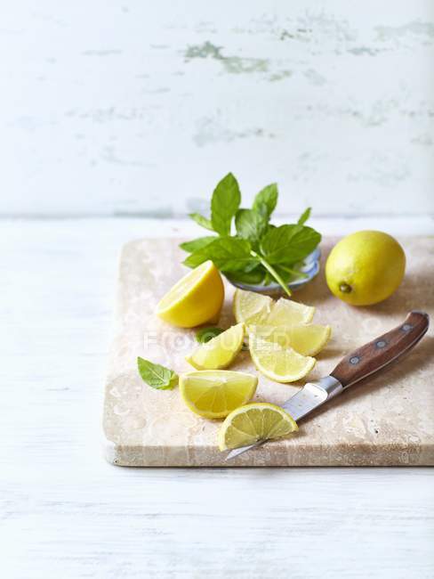 Fresh mint and lemons — Stock Photo